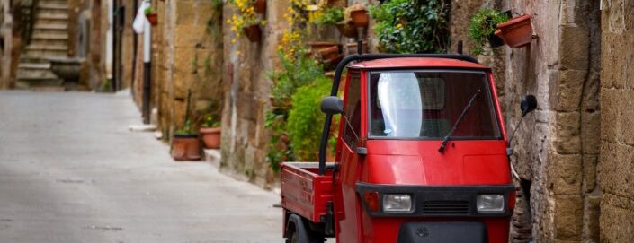 Piaggio,Ape,Standing,At,The,Empty,Street,Of,Old,Italian